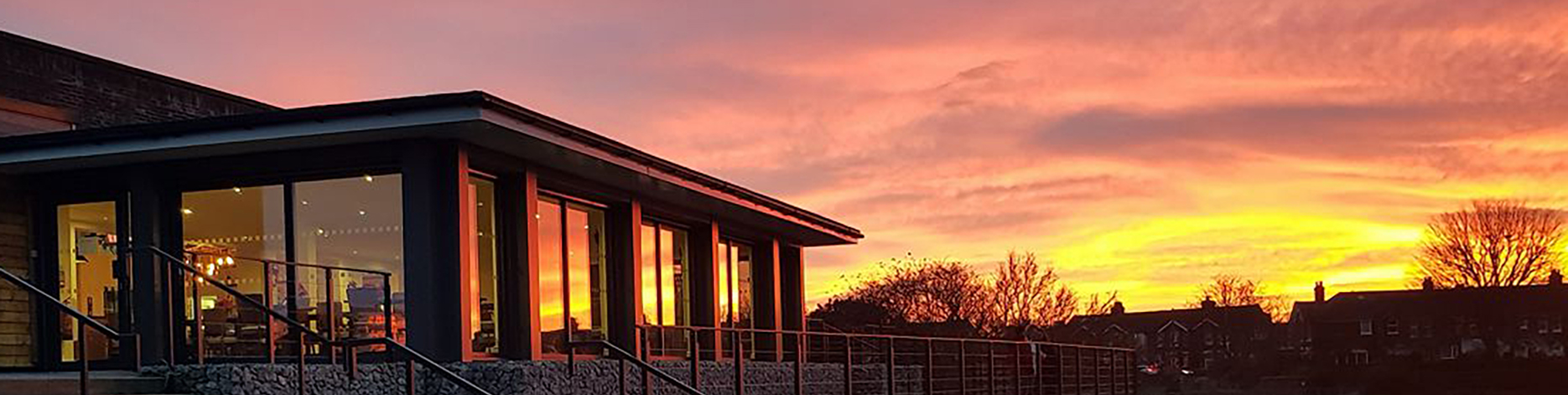 Vibrant sunset reflecting off the building at Perch in Princes Park events